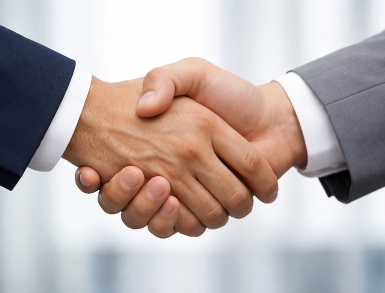 Close-up of a professional business handshake representing a successful deal, partnership, or agreement.