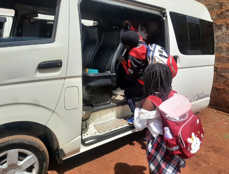 Students wearing backpacks boarding a Vanna Ventures van for private school transport services