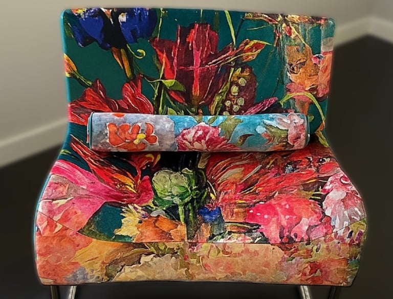 newly reupholstered modern chair with vibrant floral velvet fabric