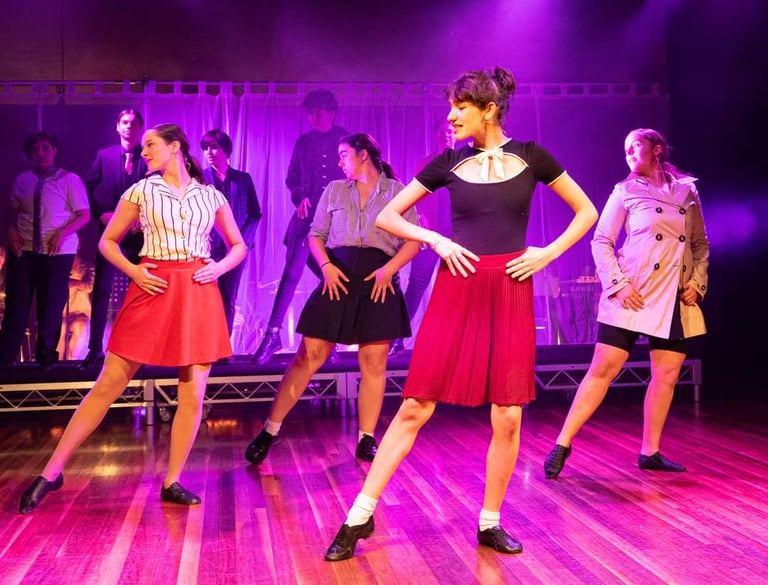 a woman in a red dress and a man in a black shirt and skirt