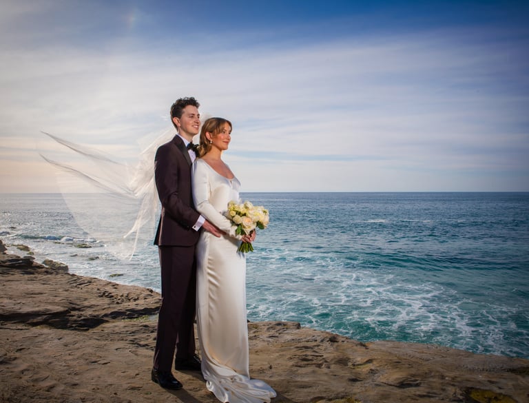 Bride and Groom standing on bluff in La Jolla, CA