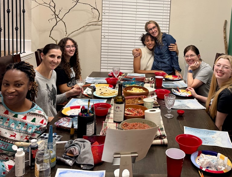 Women enjoying a Ladies’ Night watercolor painting class at Kelley’s Neighborhood Art
