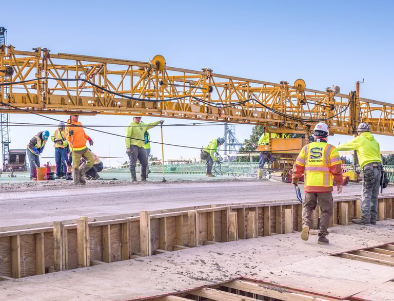 a group of construction workers working on a construction site