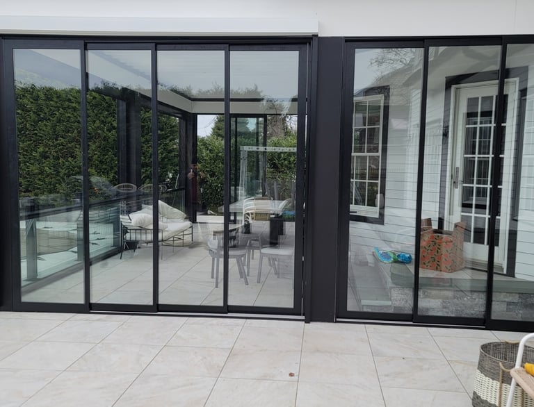 Sliding glass door system for outdoor patio enclosure