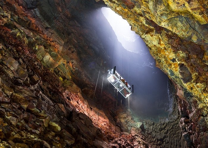 An elevator platform descends into the colorful magma chamber of Thrihnukagigur volcano in Iceland.