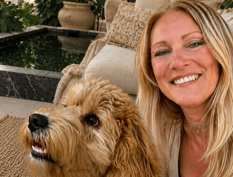 Nicole, professional pet sitter and founder of Bougie Tails, with a Goldendoodle client