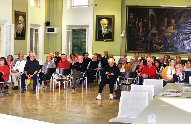 a group of people sitting at tables in a room