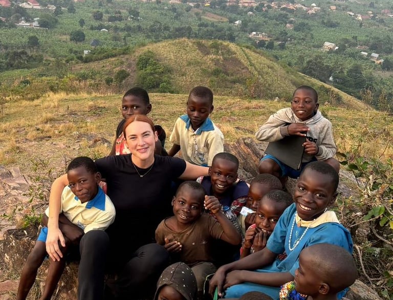 Ellen Guiney with kids in Africa