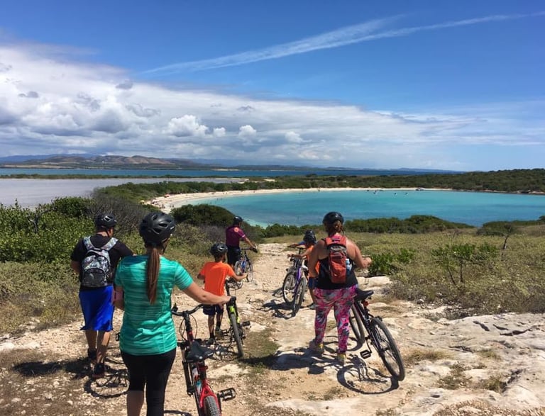 a group of people riding bikes on a trail