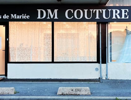 a dressmaker's dress on display in a storefront door