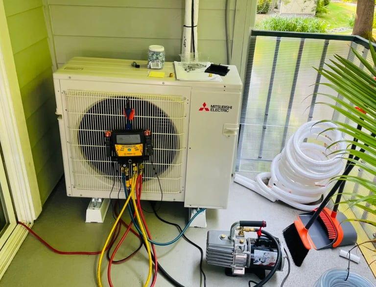 Engineer doing annual maintenance checks and readings on an Ac System on a balcony