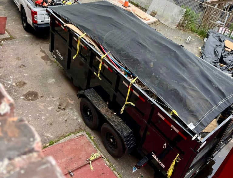 a truck with a tarp on it and a truck with a tarp on