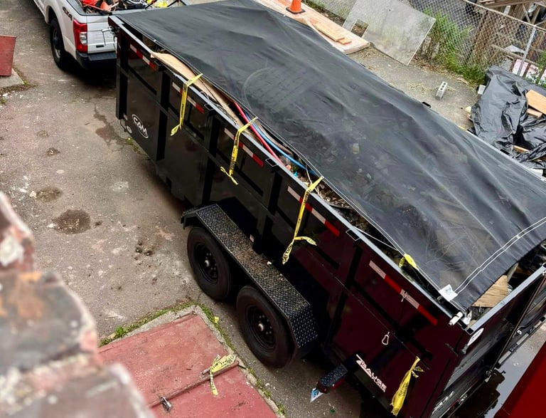a truck with a tarp on it and a truck with a tarp on