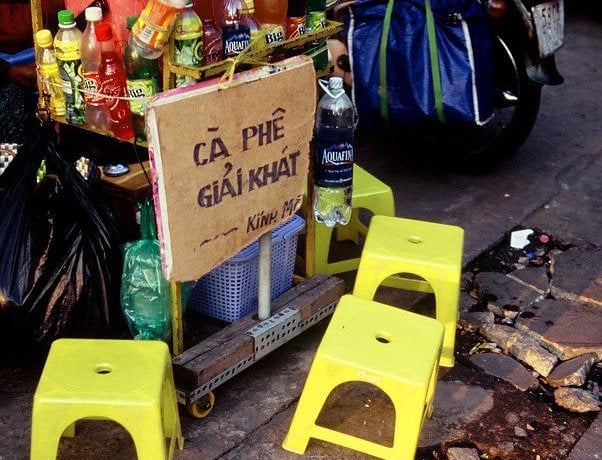 Plastic chairs in Saigon on a pavement coffee stall