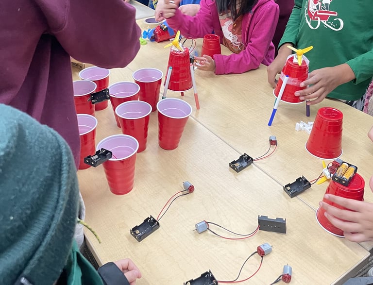 a group of student building drawing bots