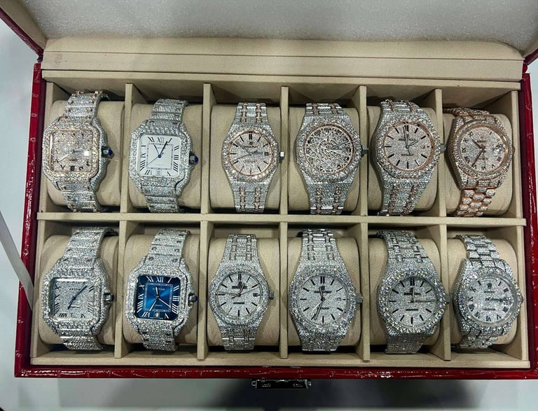 A group shot of a few Iced Out Bust Down watches IceCold has to offer