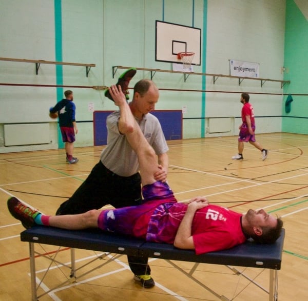 a man getting a pre event massage on a table