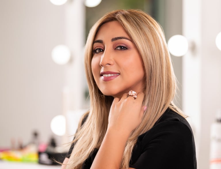 a woman with blonde hair and a ring on her finger