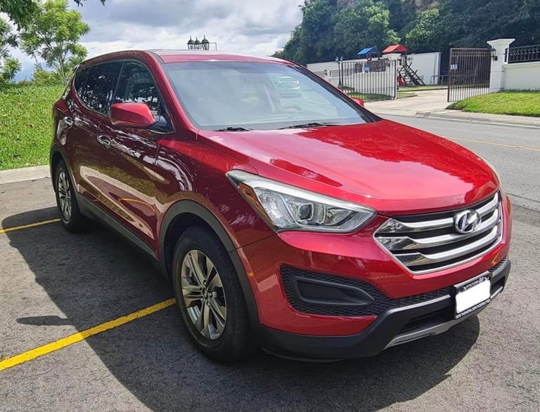a red car parked in a parking lot
