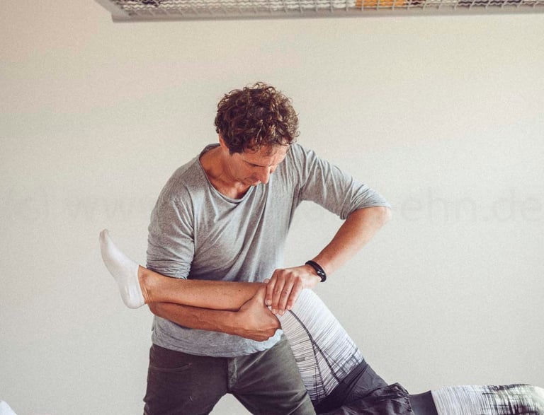 a man is doing a physical exercise on a table