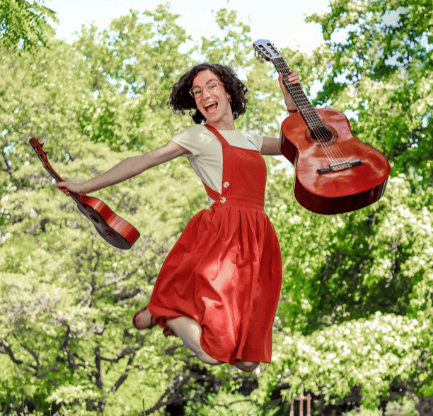 a woman in a red dress is jumping in the air