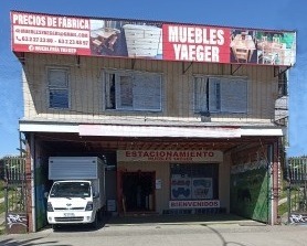 a truck parked in front of a building