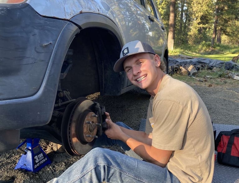 Our technician happily working on a car