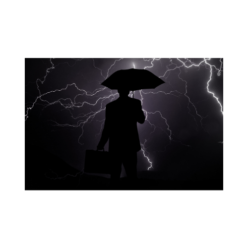 A person with an umbrella in a storm, symbolizing overcoming challenges
