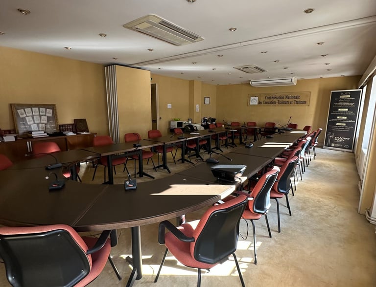 a conference room with a long table and chairs
