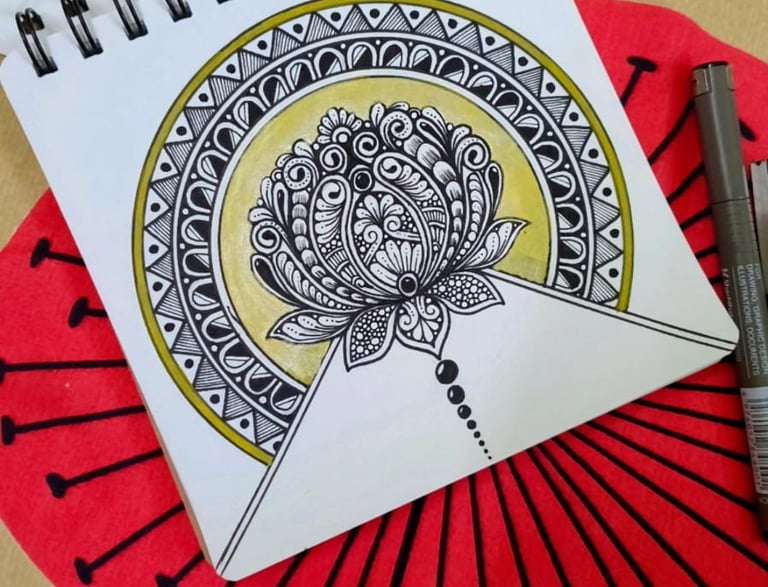 a notebook with a pen and a pen on it