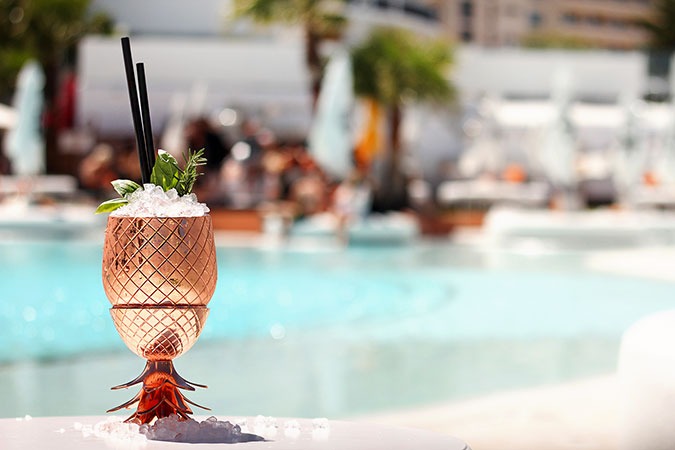 a cocktail in a pineapple cocktail glass