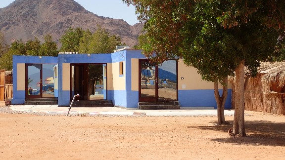 3 Studios blue building with a mountain in the background