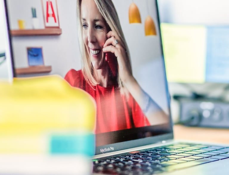 Catherine Aygen on the phone and on a Zoom call