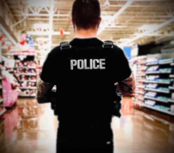 Uniformed off-duty police officer providing security at a Pacific Northwest retail location
