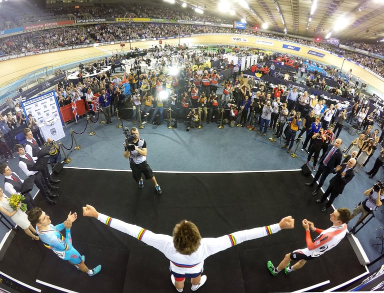 a man celebrating after wining a medal at a major championships