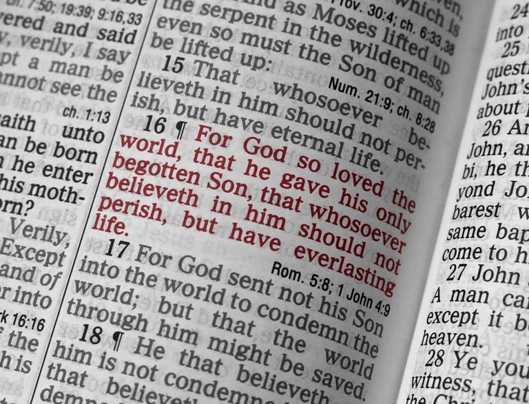 a book opened to show a bible verse