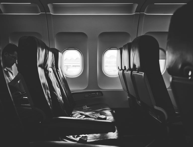 grayscale photo of airplane seats
