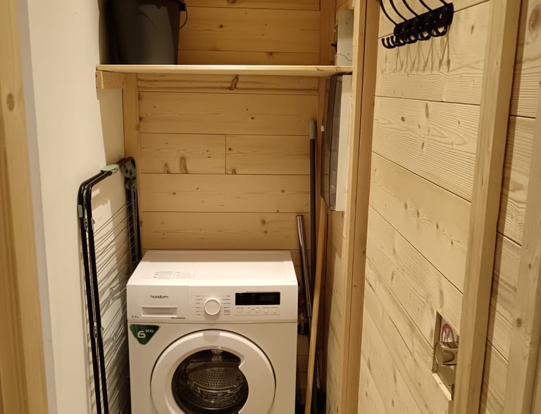Built-in washing machine and alpine storage area in the StayValThorens apartment in Val Thorens