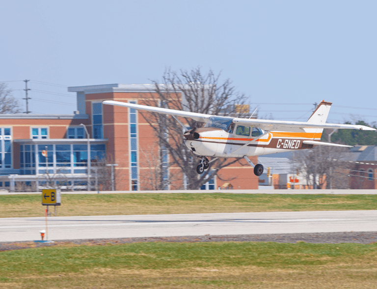 a small plane taking off from a runway