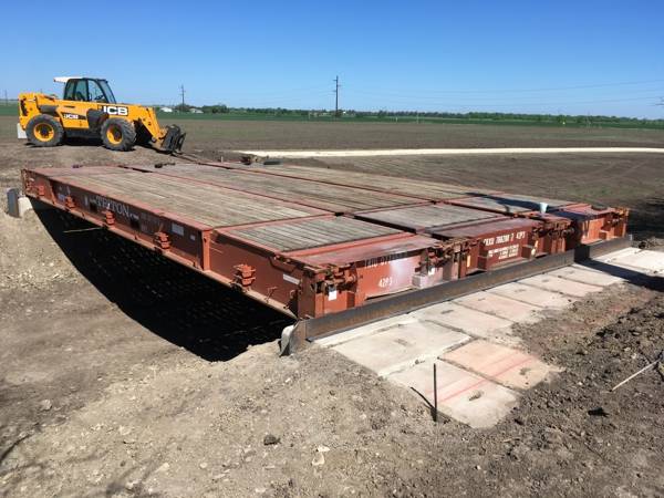 3 red Flat Racks side by side as a bridge over a canal