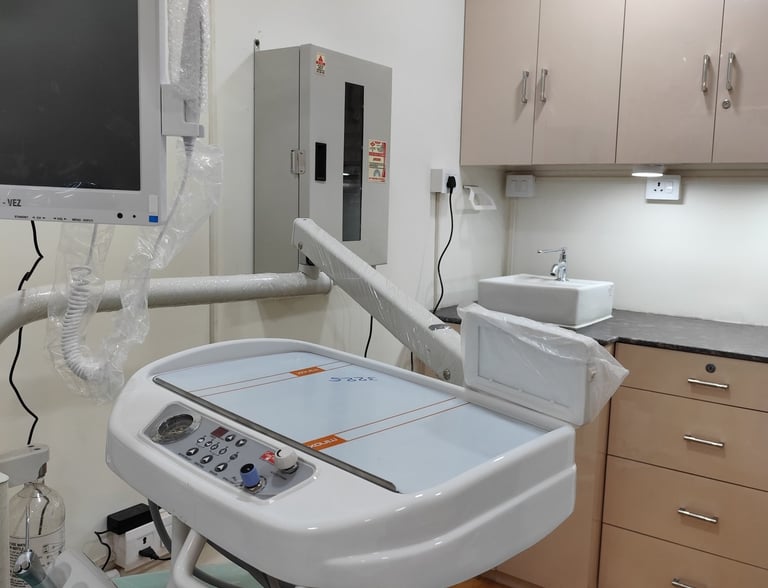 Modern dental clinic setup featuring an advanced delivery unit, monitor, and clean surgical workspace.