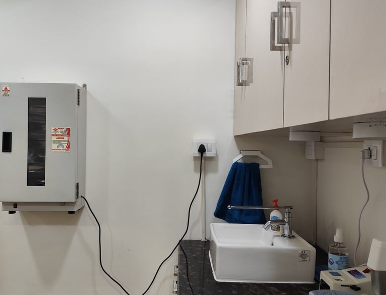 White medical hand washing station with a small sink, chrome faucet, and uv chamber 