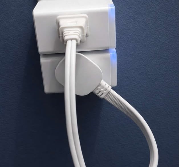 Low profile outlet extender allowing plugs to sit flush against the wall