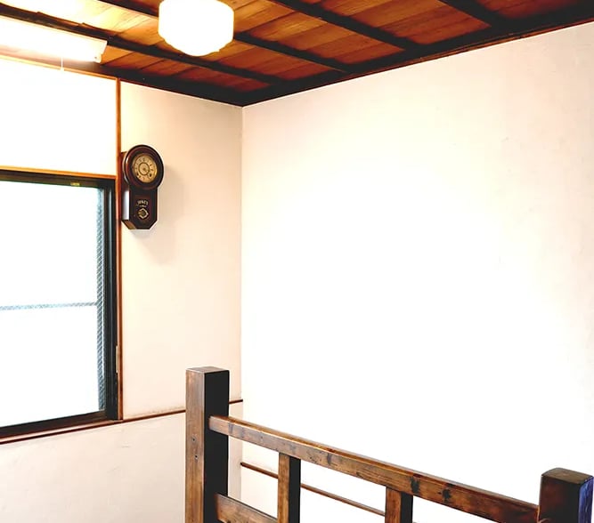 A historic wooden staircase showcasing traditional Japanese architecture at Nakadaya.