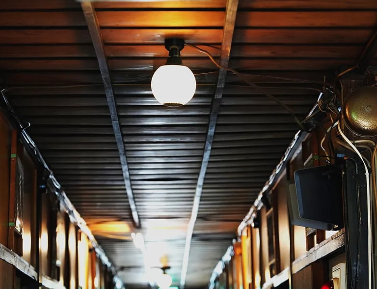 A nostalgic wooden hallway at Ryokan Nakadaya Asakusa, reflecting traditional Japanese architecture.
