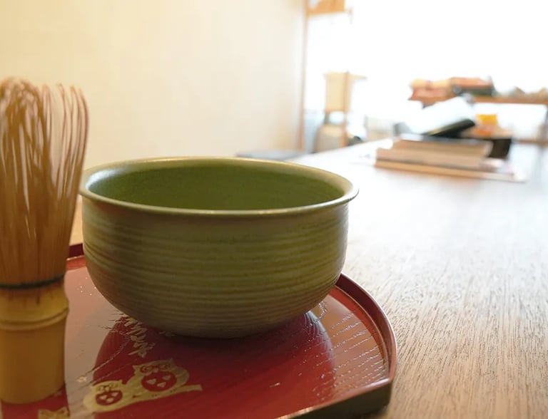 Relaxing with matcha green tea in the historic common room at Ryokan Nakadaya Asakusa.