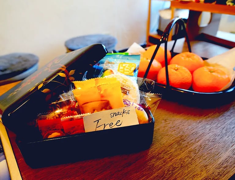 Nakadaya Asakusa: The cozy traditional Japanese common room with a warm atmosphere.