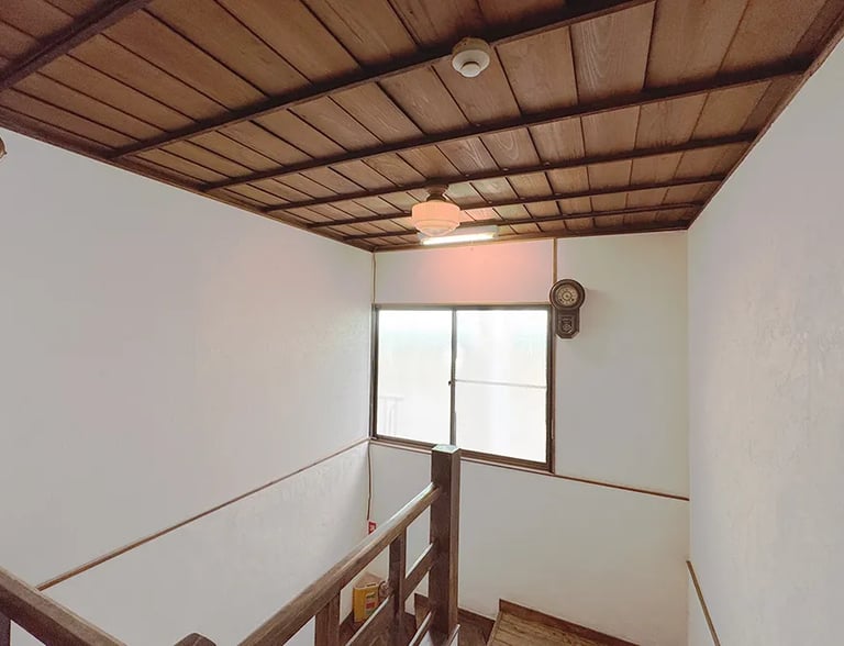 A historic wooden staircase showcasing traditional Japanese architecture at Nakadaya.