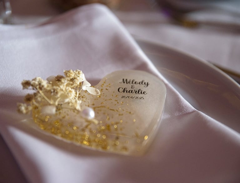 a heart shaped cake with a gold leaf decoration
