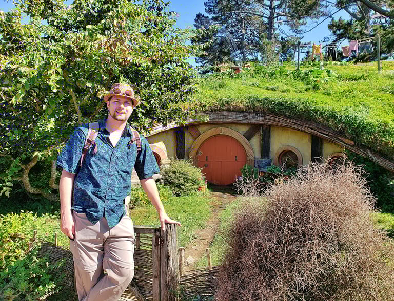 Steven checking out the hobbit-holes in Hobbiton in New Zealand